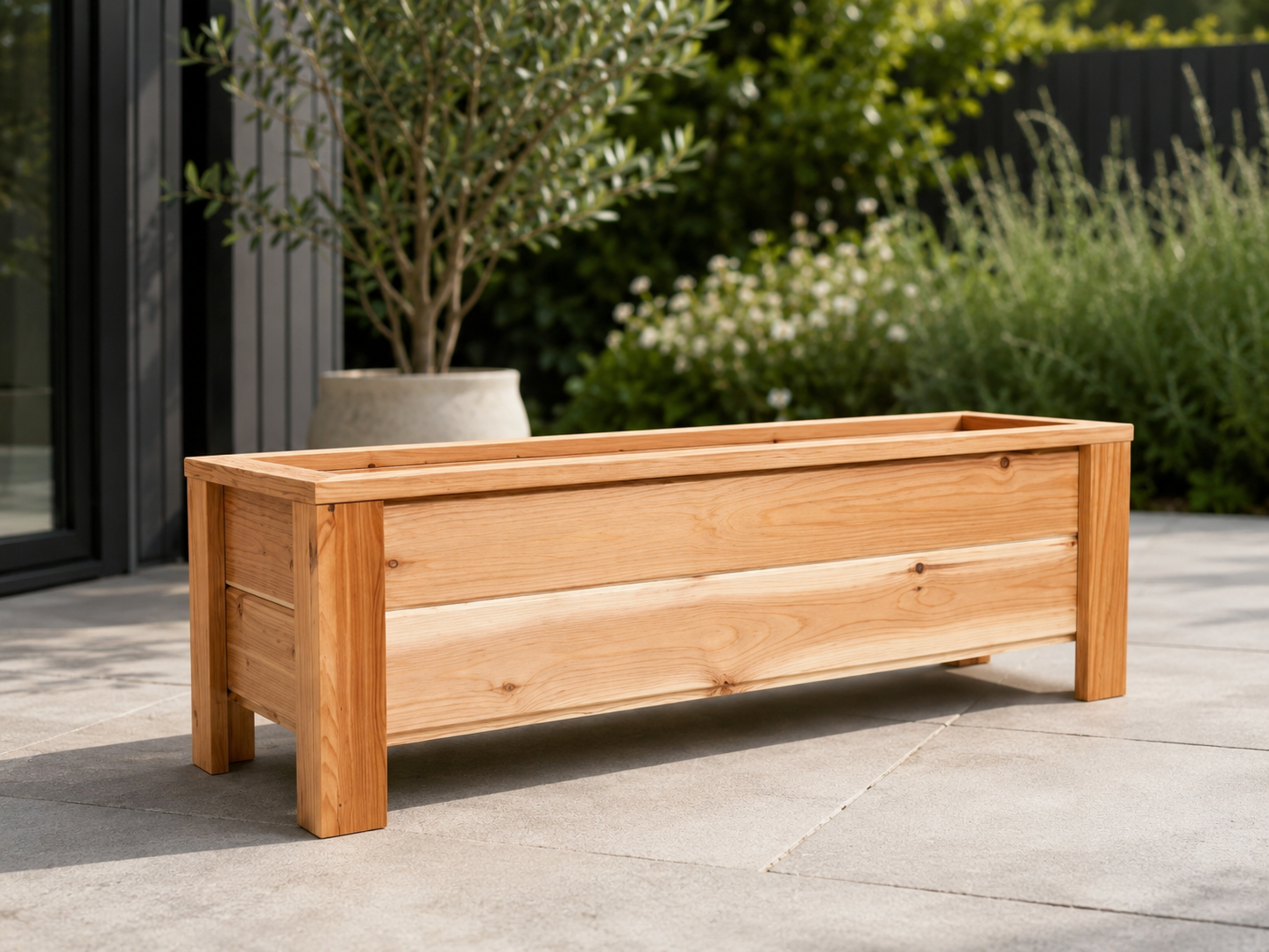 Long narrow cedar balcony planter against a railing with flowers