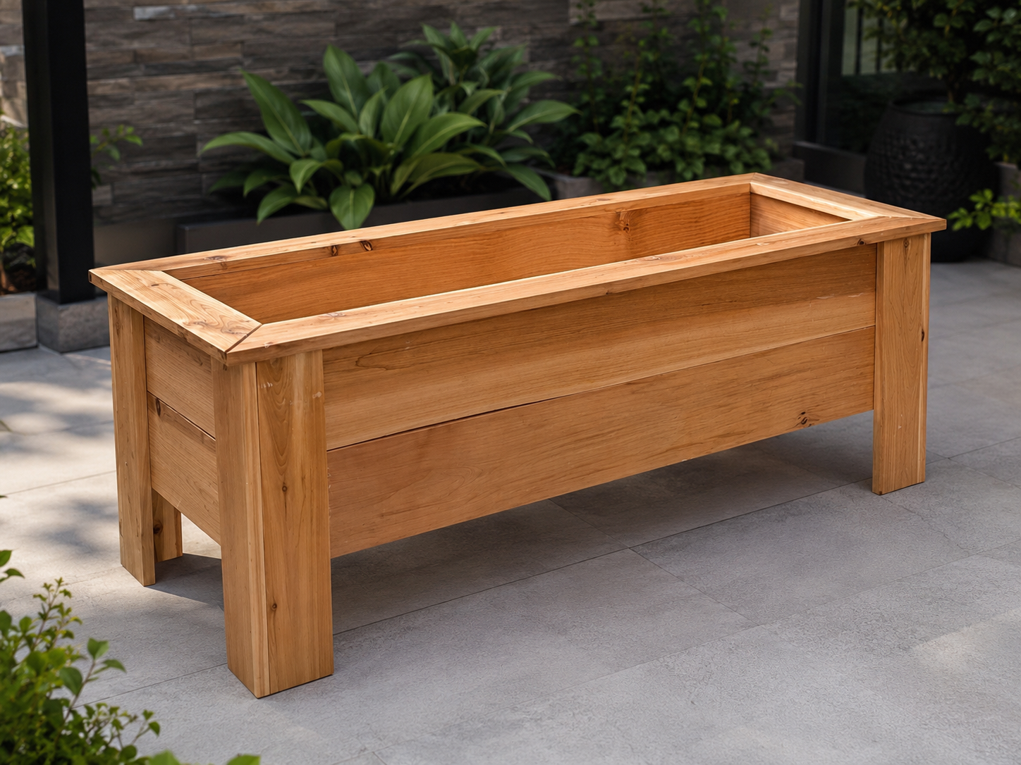 Large cedar planter box with shrubs in a residential courtyard
